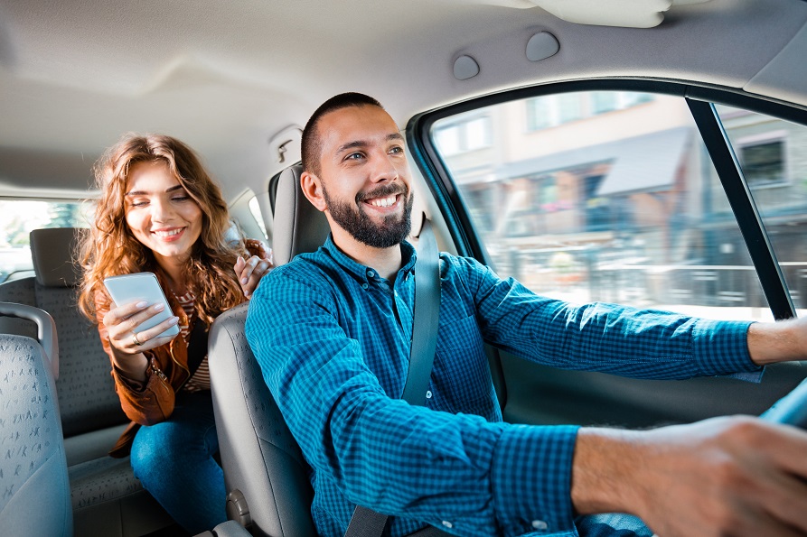 Driver talking with female passenger woman
